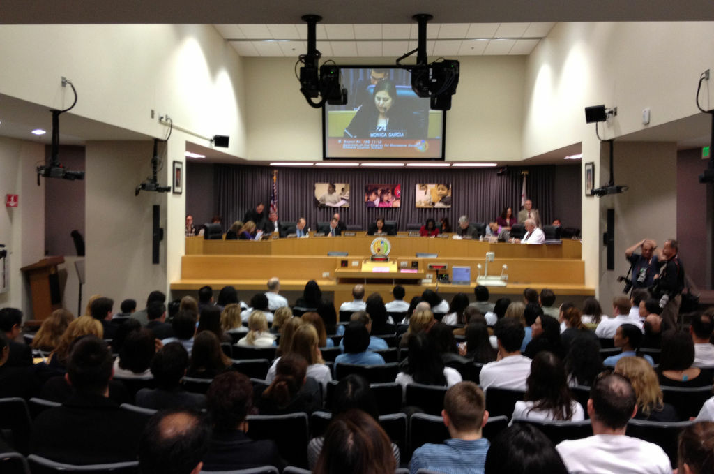 Attendees watch a meeting of the LAUSD Board of Education