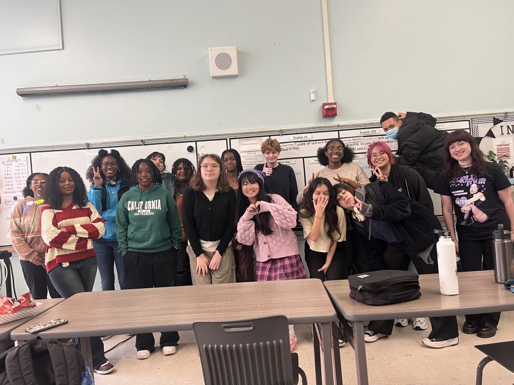 Attendees of a weekly AAPI Culture Club meeting pose in room D11.