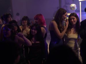 11th- and 12th-grade students gather on the dance floor at the Masquerade-themed WISH Academy Prom at The Shay on Saturday, April 27th.